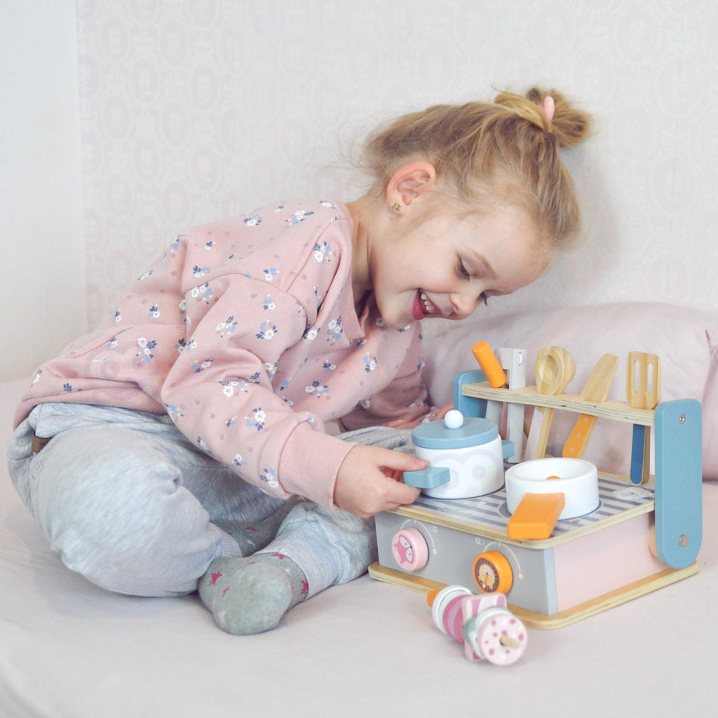 bold wooden folding stove and grill toy with colorful accessories for imaginative play