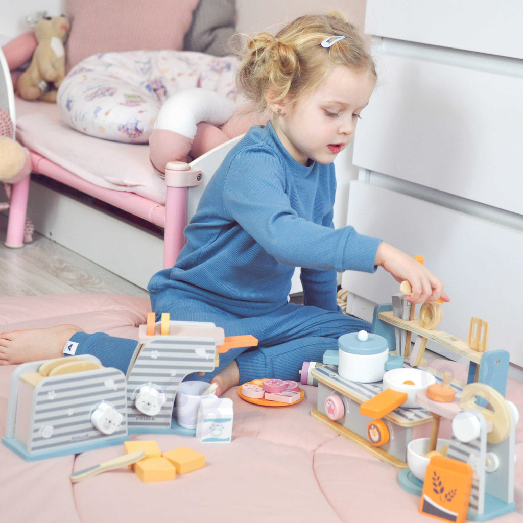 wooden folding stove and grill toy with colorful accessories, play food, and fold-out sides for imaginative cooking fun