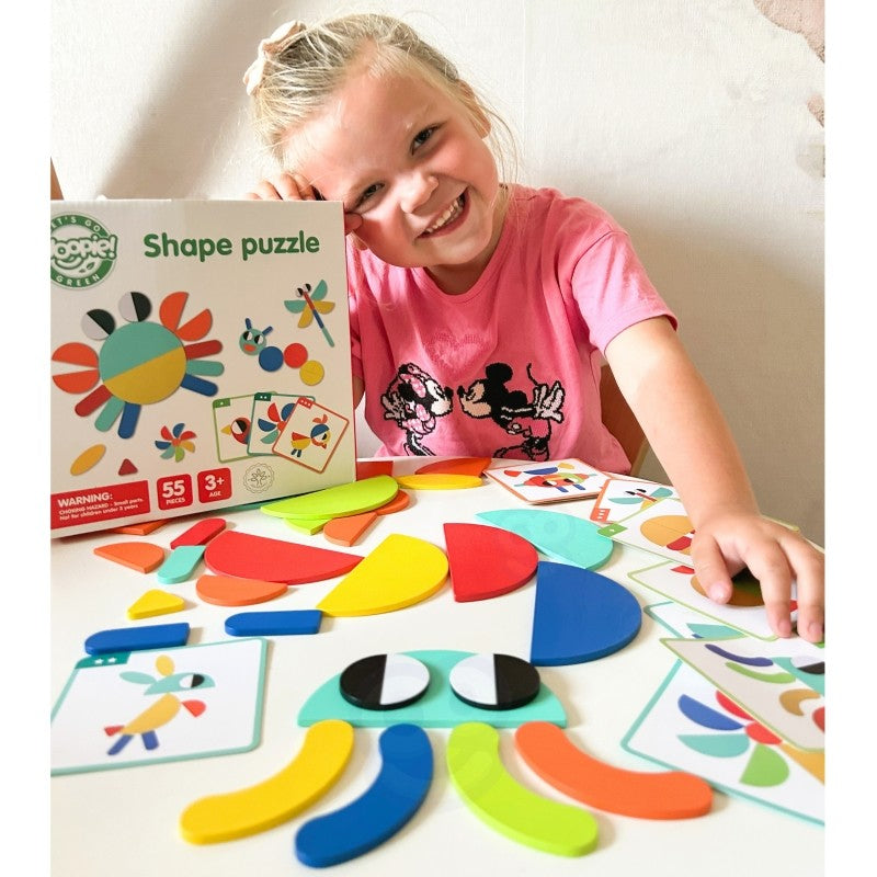 confident child solving a vibrant wooden montessori puzzle with 55 colorful pieces