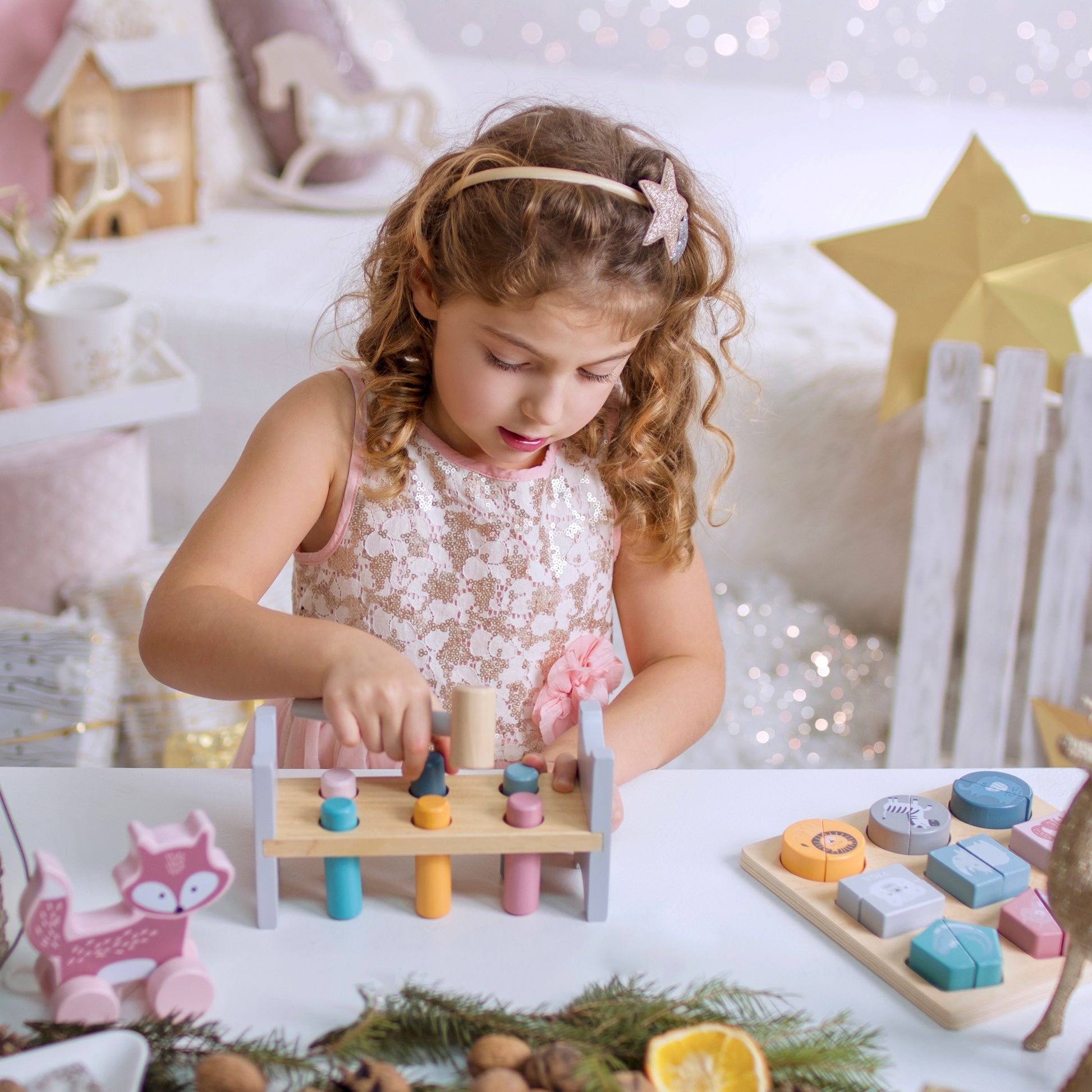 soft pastel wooden pyramid and pounding bench with hammer for toddlers, promoting motor skills and color recognition