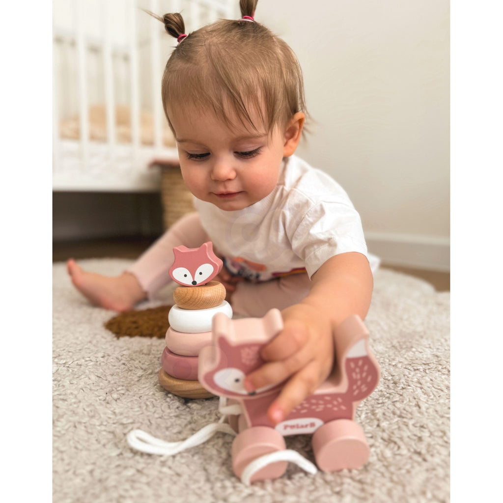 bold wooden fox pull toy and pastel pyramid set for toddlers, vibrant colors on natural wood