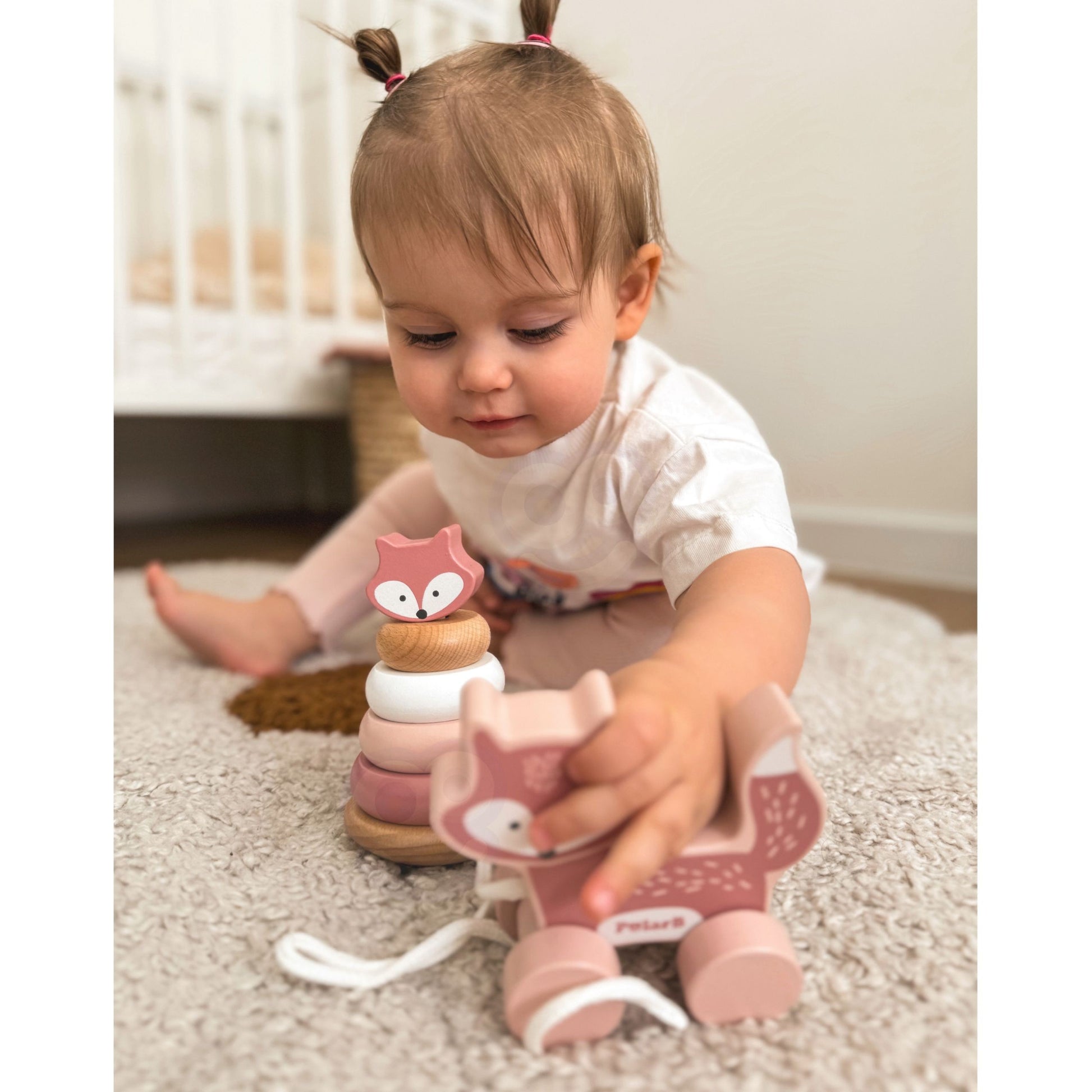 bold wooden fox pull toy and pastel pyramid set for toddlers, vibrant colors on natural wood