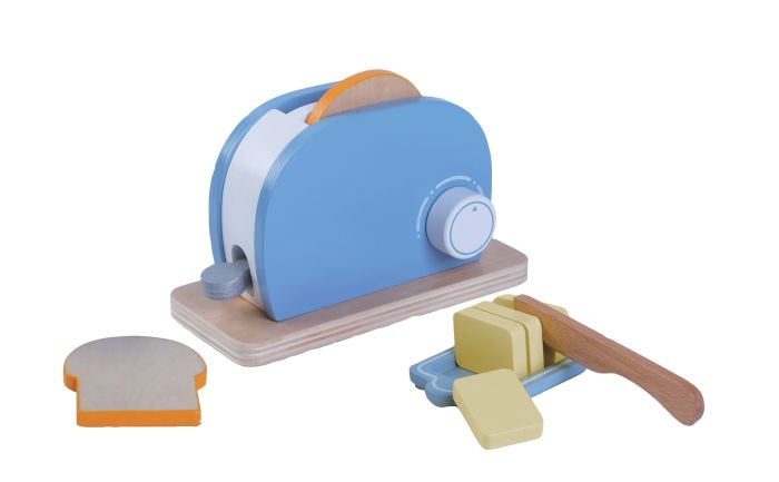 a soft-lit shot of a child's hand placing a wooden bread slice into the cozy pastel toaster