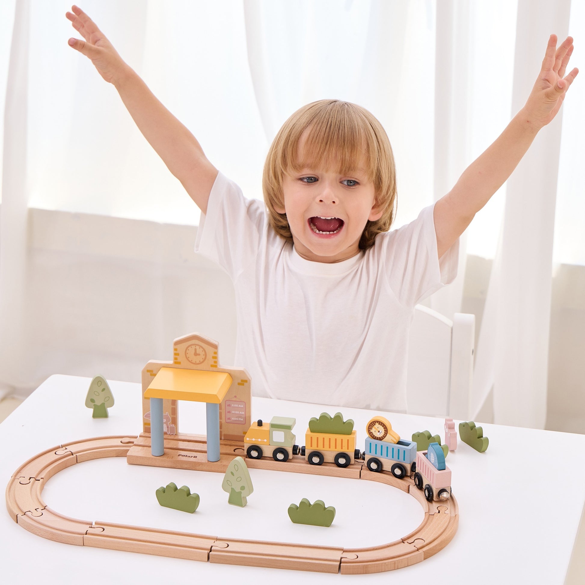 wooden train set with xylophone and threading toys for toddlers, soft pastel colors on a wooden table