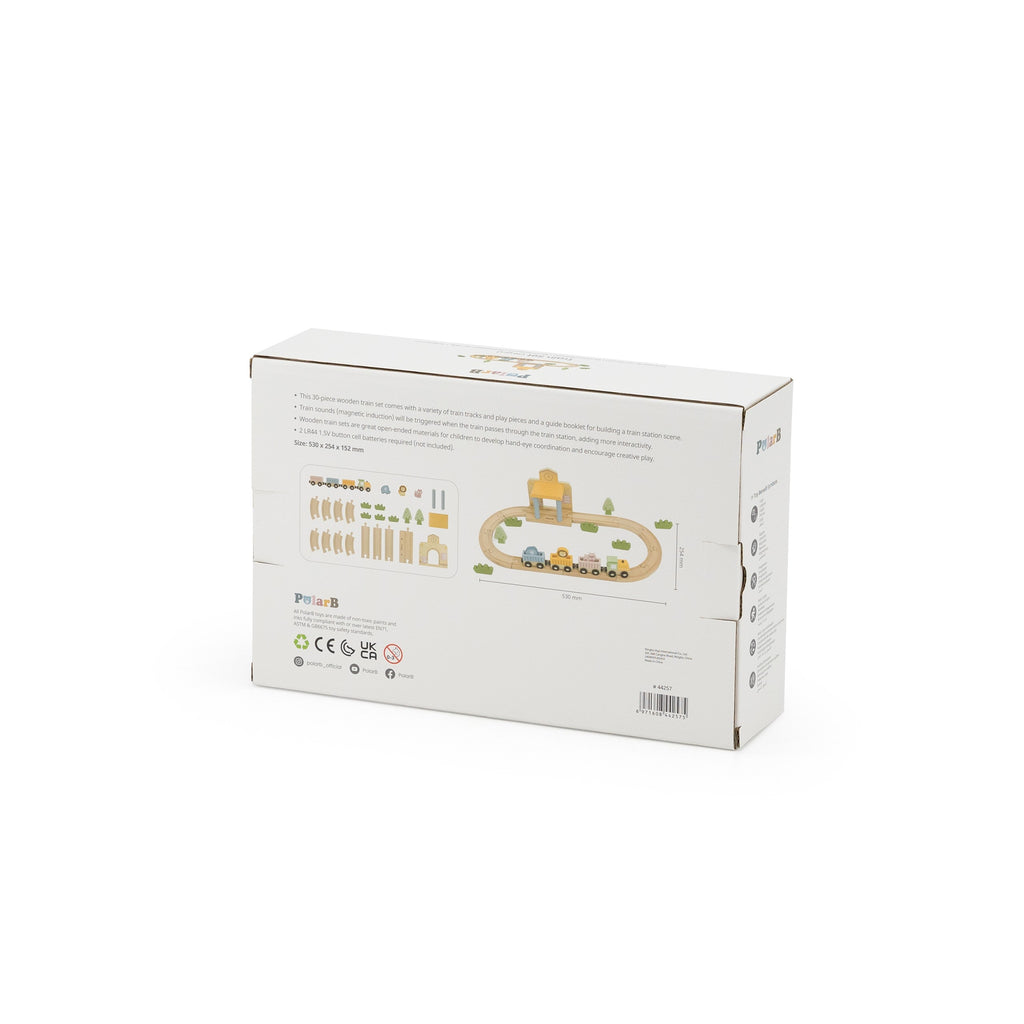 wooden train set with xylophone and threading activity laid out on a wooden table, showcasing fine motor skill development