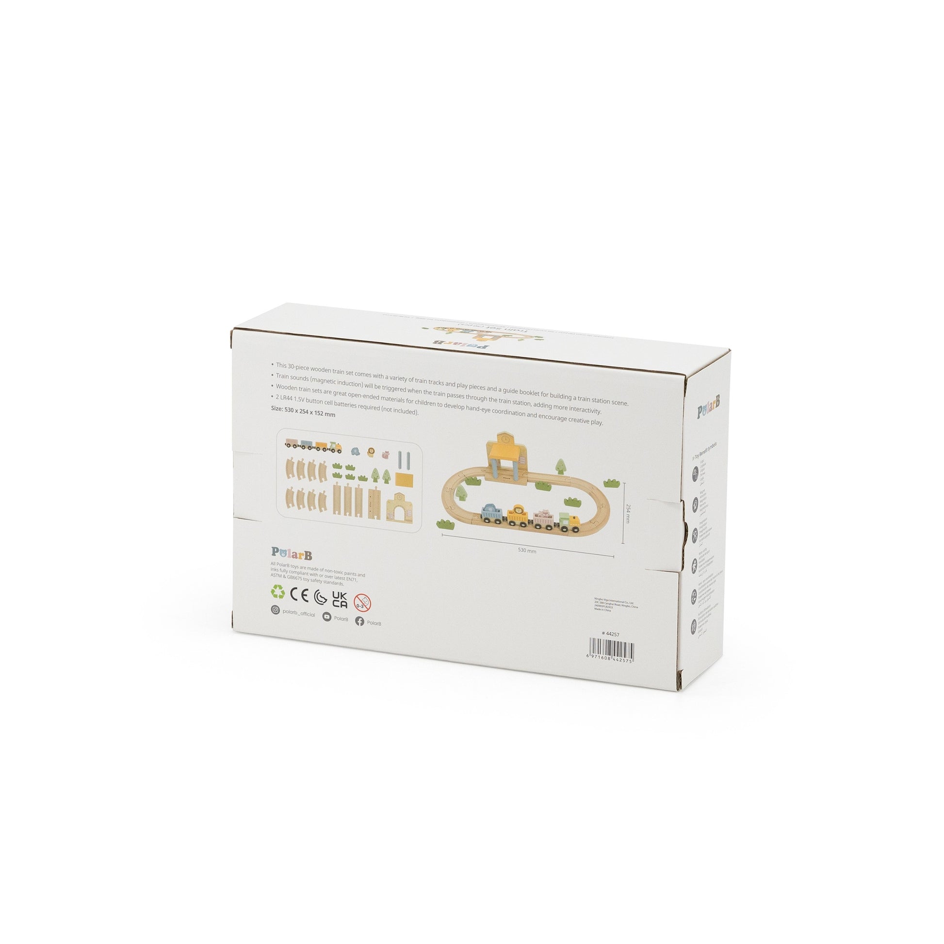 wooden train set with xylophone and threading activity laid out on a wooden table, showcasing fine motor skill development