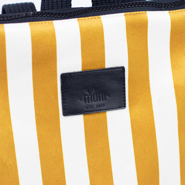 Striped Mustard Backpack for Kids – Durable & Stylish Outdoor Gear by Muni at www.brixbailey.com